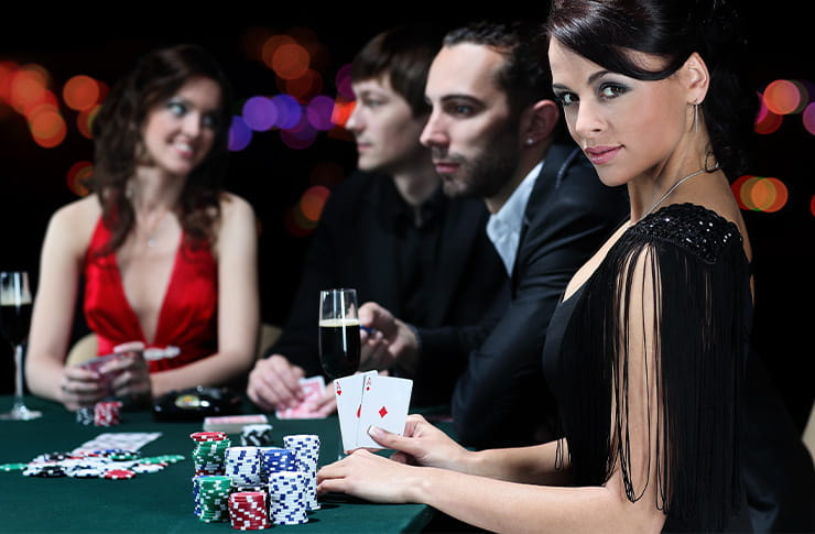 Elegant Woman Holding a Pack of Card on Casino Table