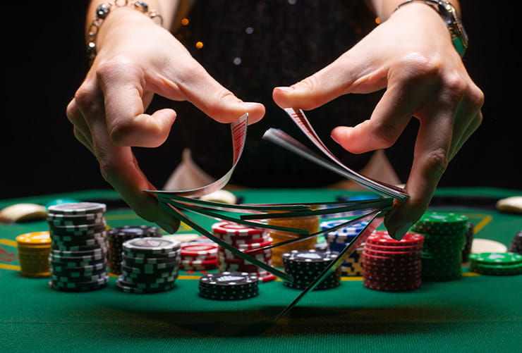 Two Hands Shuffeling Casino Cards