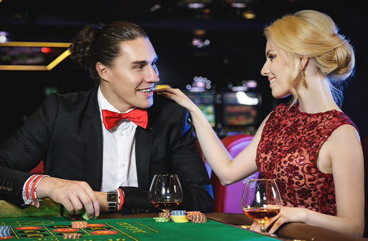 Man and Woman Drinking on a Casino Table