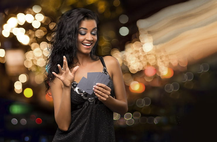 A Girl at Viejas Holding a Winning Hand of Cards